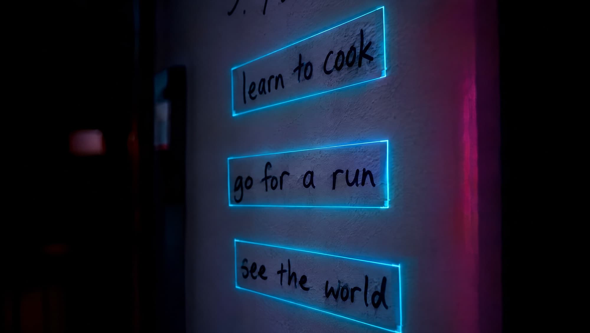 Handwritten phrases on a wall, each outlined by a glowing frame as it is read